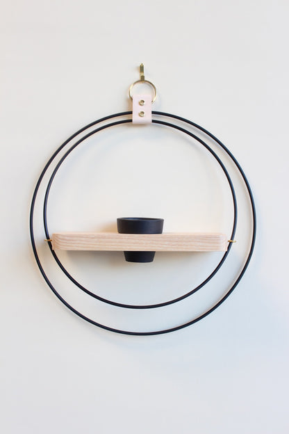 matte black and light wood circular wall mounted hanging planter for air plants